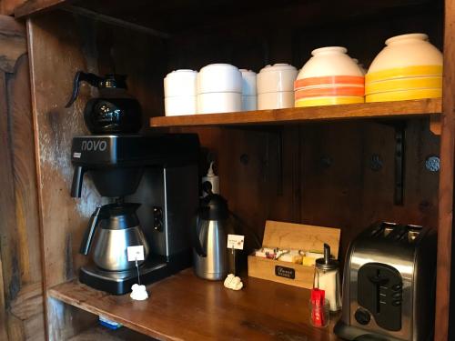 Kaffee-/Teezubehör in der Unterkunft Hotel du Centre - Restaurant le P'tit Gourmet