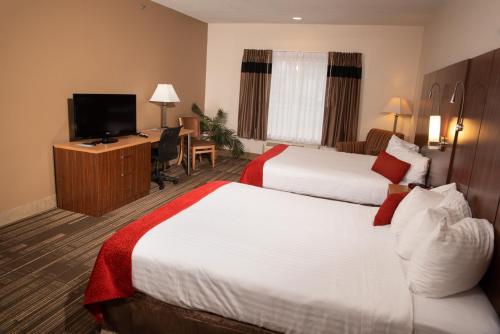 Ένα ή περισσότερα κρεβάτια σε δωμάτιο στο Northfield Inn Suites and Conference Center