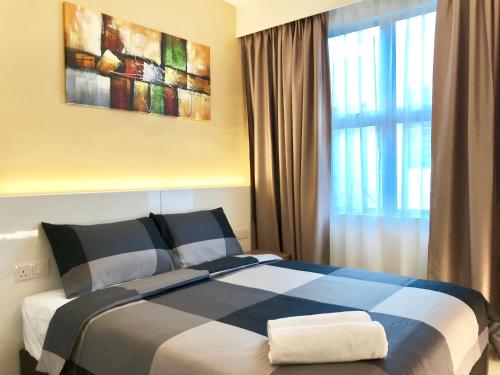 En eller flere senger på et rom på RIVERO BOUTIQUE HOTEL Seremban 2
