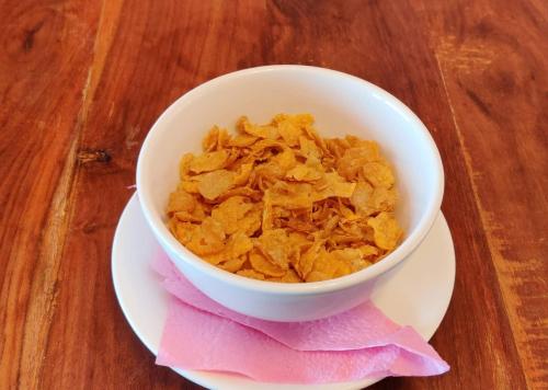 a bowl of cereal sitting on a plate on a table at Hotel Nagarkot Inn in Nagarkot