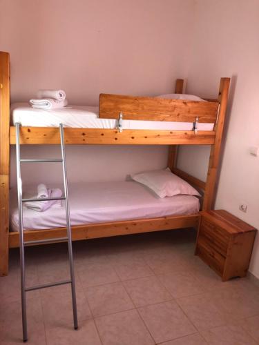 a couple of bunk beds in a room at Anna House Palouri in Paliouri