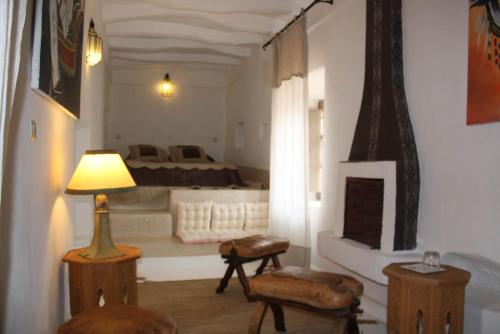 Ένα ή περισσότερα κρεβάτια σε δωμάτιο στο Riad El Koudia