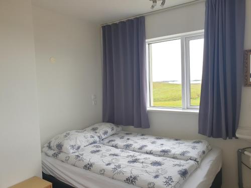 Ein Bett oder Betten in einem Zimmer der Unterkunft Hafnarnes