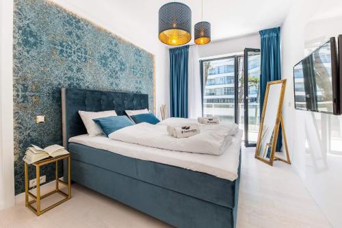 Ένα ή περισσότερα κρεβάτια σε δωμάτιο στο Dune Resort - B