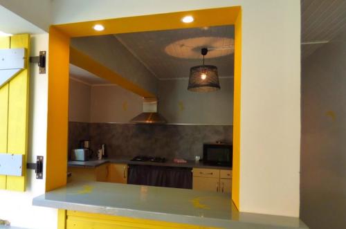 Kuchyň nebo kuchyňský kout v ubytování Habitation Diamant - Apparts & Spas