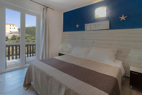 Cama o camas de una habitación en Albergo Serena