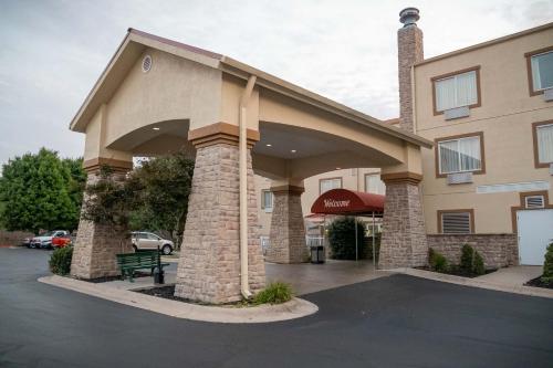a building with a parking lot in front of it at Baymont by Wyndham Springfield I-44 in Springfield
