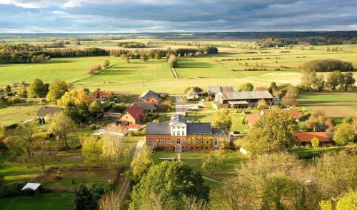 an aerial view of a large house in a field at Gut Pohnstorf in Alt Sührkow