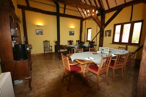 a dining room with a table and chairs at Upper Neatham Mill in Alton