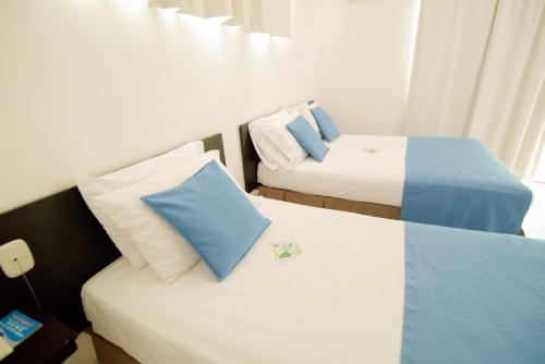 Voodi või voodid majutusasutuse Hotel Maranata Valledupar toas