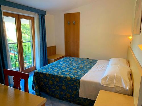 Cama o camas de una habitación en Hotel La Pergoletta