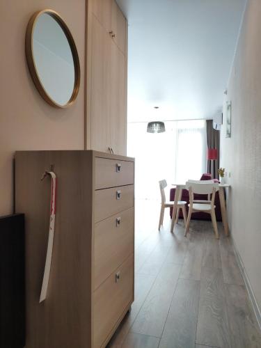 a bathroom with a dresser and a mirror and a table at Green Line in Mtsvane Kontskhi