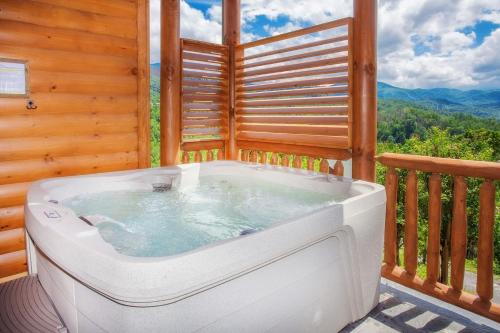 a hot tub on the balcony of a cabin at Bella Vista Lodge in Gatlinburg