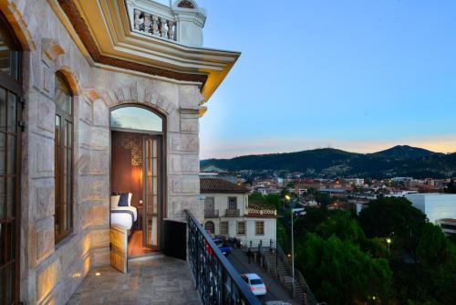 a balcony of a building with a view of a city at Hotel Cruz del Vado by Art Hotels in Cuenca