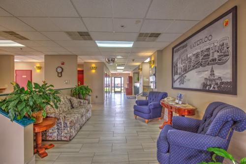 a waiting room with couches and chairs in a hospital at Super 8 by Wyndham Waterloo in Waterloo