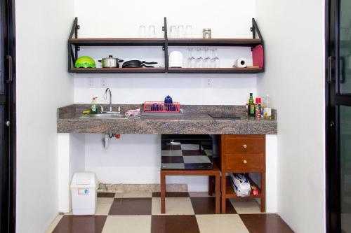 a kitchen with a counter and a sink at Casa NE in Mérida