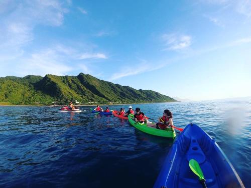 a group of people in kayaks on the water at Bridge12th B&B in Yanliau