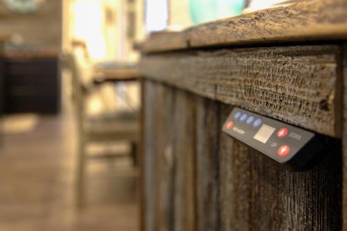 a close up of a wooden fence with red buttons at The Shoreline Container Home 12 min to Magnolia Silos and Baylor in Waco