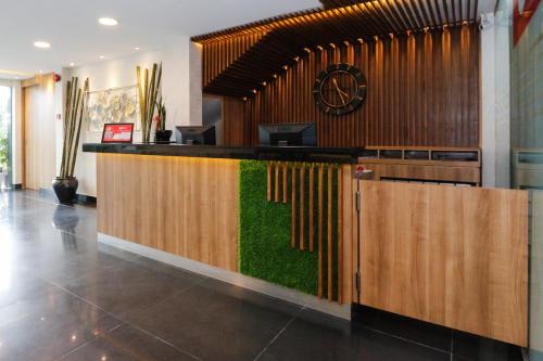a lobby with a bar with grass on it at My Hotel @ KL Sentral in Kuala Lumpur
