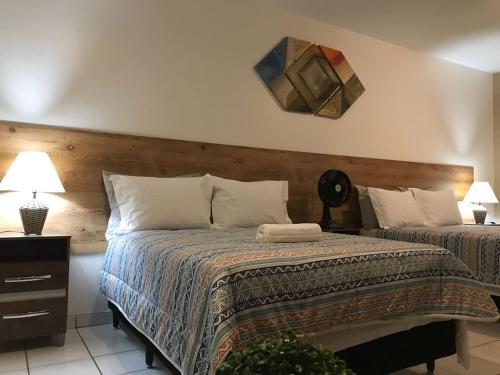 מיטה או מיטות בחדר ב-B & A Suites Inn Hotel - Quarto Luxo Exclusive