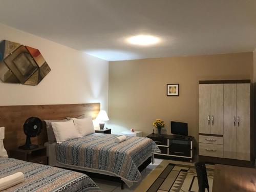 Katil atau katil-katil dalam bilik di B & A Suites Inn Hotel - Quarto Luxo Exclusive