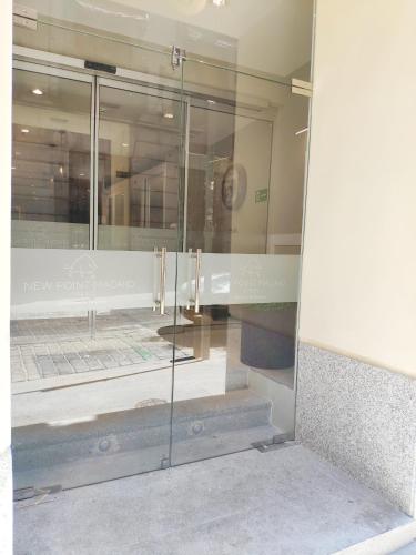 a display window of a store with reflections in the glass at New Point Opera in Madrid