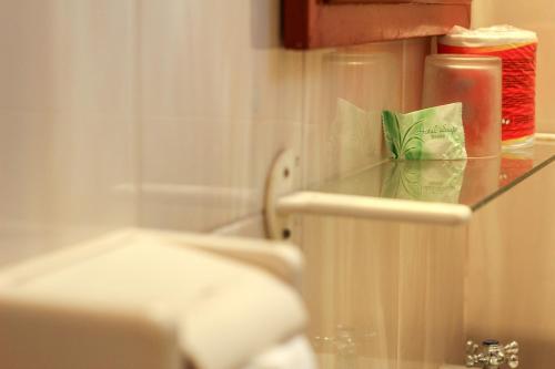 a bathroom with a counter with a roll of toilet paper at Delta Homestay in Yogyakarta