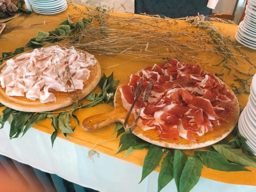 two pizzas sitting on top of a table at Hotel Margareth in Riccione