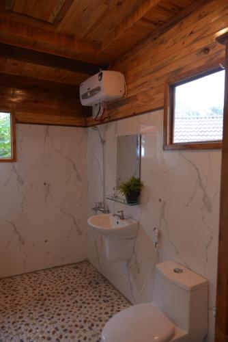 a bathroom with a toilet and a sink at Cay Sao Resort in Phú Quốc