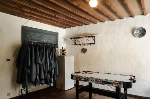 a room with a table and a chalkboard on the wall at Villa Vigor in Peer