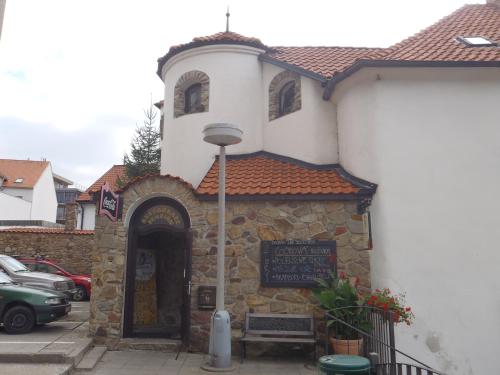 a building with a sign in front of it at Penzion na Zborově in Strakonice