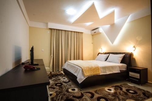 Posteľ alebo postele v izbe v ubytovaní Hotel Oasis