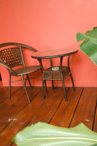 a table and two chairs and a table and a table and chair at Saree Lagoon Villa Koh Samui in Lipa Noi