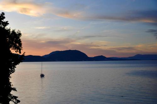 a boat in the middle of a large body of water at Casa del Mar in Mpoukaris