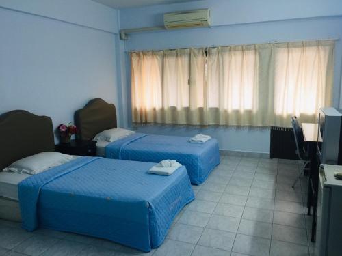 Postel nebo postele na pokoji v ubytování TKC condo