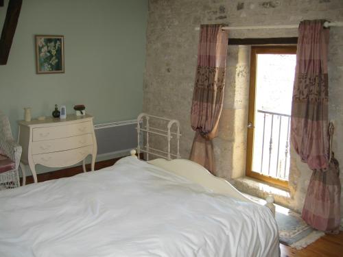 Llit o llits en una habitació de Gite du Puits - Bréville