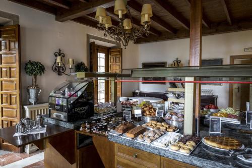 a bakery counter with various types of pastries at Parador de Cambados in Cambados