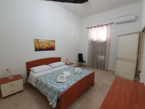 Postel nebo postele na pokoji v ubytování Casa Francy a 5min da Marzamemi