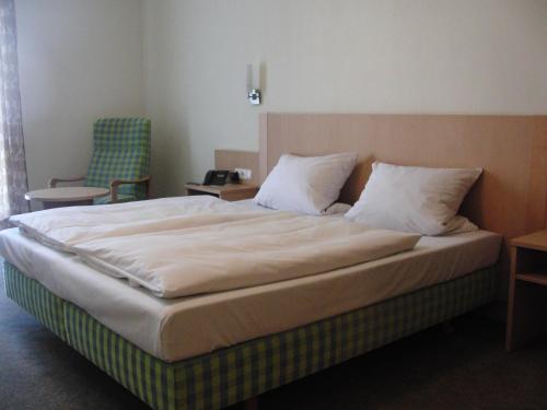 Postel nebo postele na pokoji v ubytování Hotel Angerer
