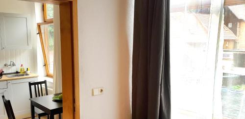 a kitchen with a window and a table and a kitchen at Art Apartment - Harz in Stolberg i. Harz