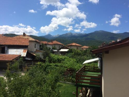 a view of a village with mountains in the background at Mira Guest House in Dobrinishte