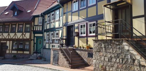a colorful building with a staircase in front of it at Art Apartment - Harz in Stolberg i. Harz