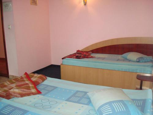 a room with two bunk beds in a room at Pensiunea Marc in Suceava