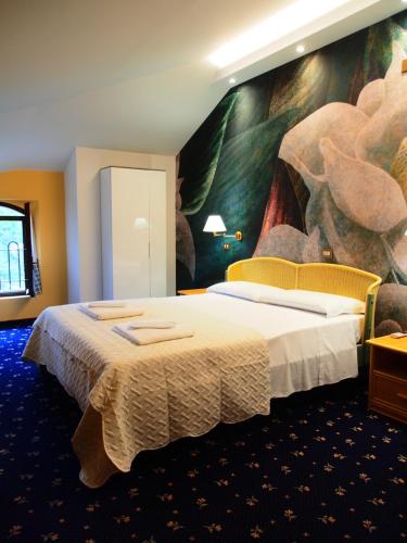 Posteľ alebo postele v izbe v ubytovaní Hotel Parco Fola