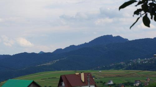a view of a valley with mountains in the background at HRYCÓWKA Domki z Widokiem in Grywałd
