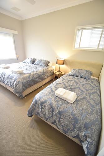 Una cama o camas en una habitación de Bõucher Manor - Northam