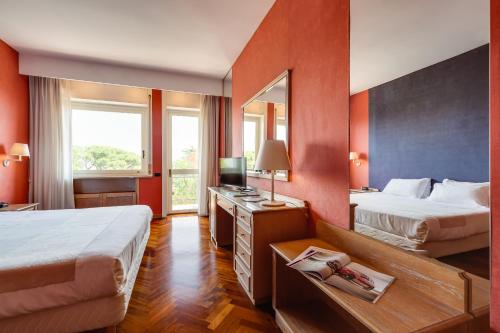Katil atau katil-katil dalam bilik di Culture Hotel Villa Capodimonte