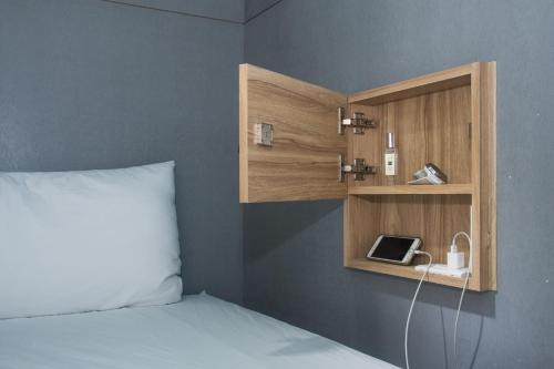 Postel nebo postele na pokoji v ubytování Liuqiu Dive Hostel