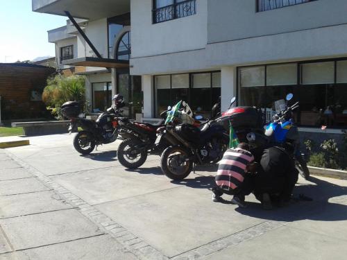 a group of motorcycles parked in front of a building at Hotel Los Andes in Los Andes