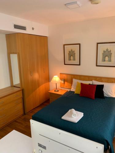 Łóżko lub łóżka w pokoju w obiekcie Charmoso Flat em Pinheiros